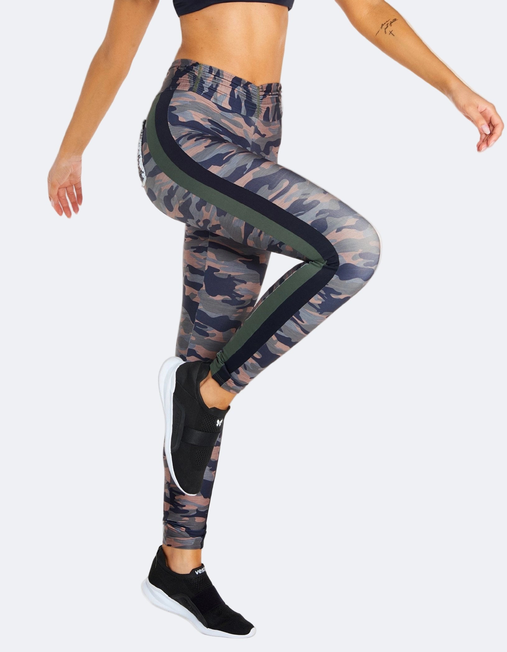 Camouflage leggings with a green stripe on a white background