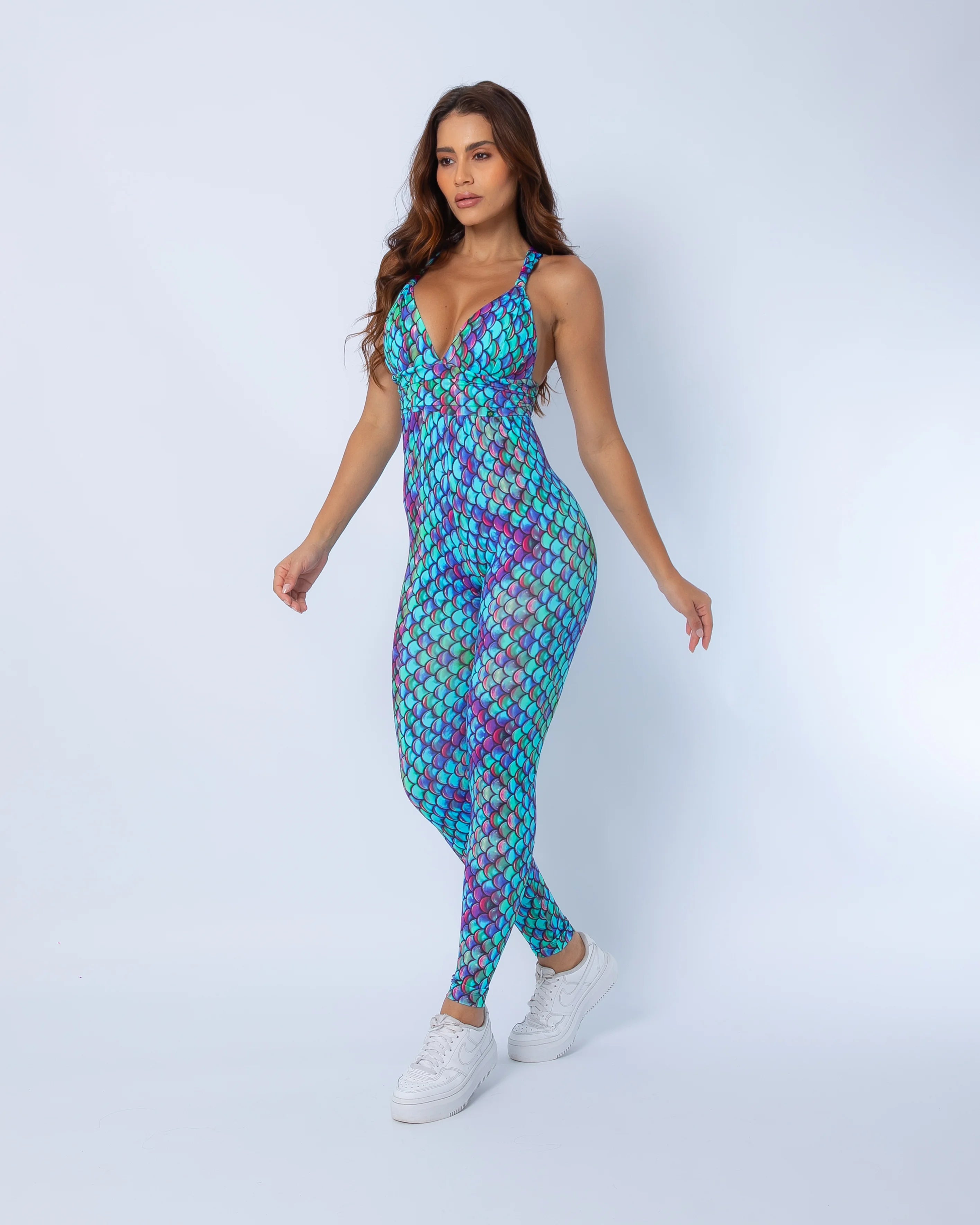 Side view of mermaid print jumpsuit showing fitted waist and sculpted silhouette in Aqua Swim fabric.