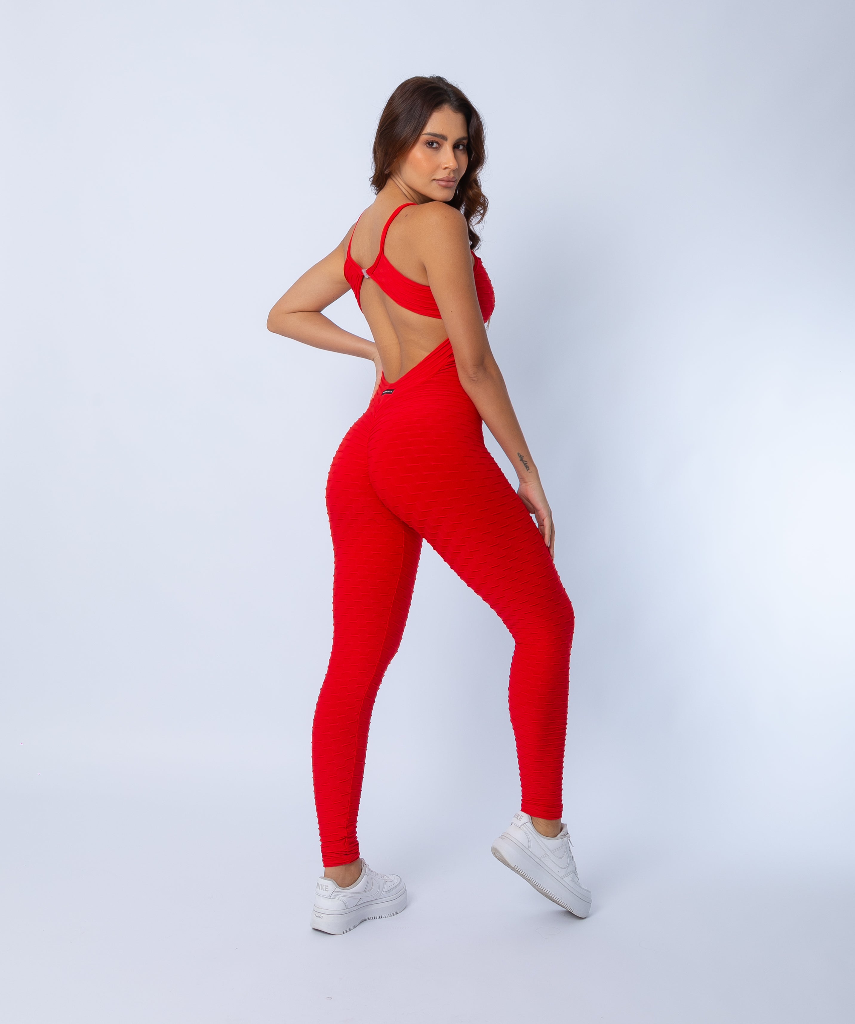 Fashion Brazil Amelia Red Jumpsuit, angled back and side view emphasising scrunch-back seam, curve-enhancing lift, and premium Zero Flaws textured fabric.