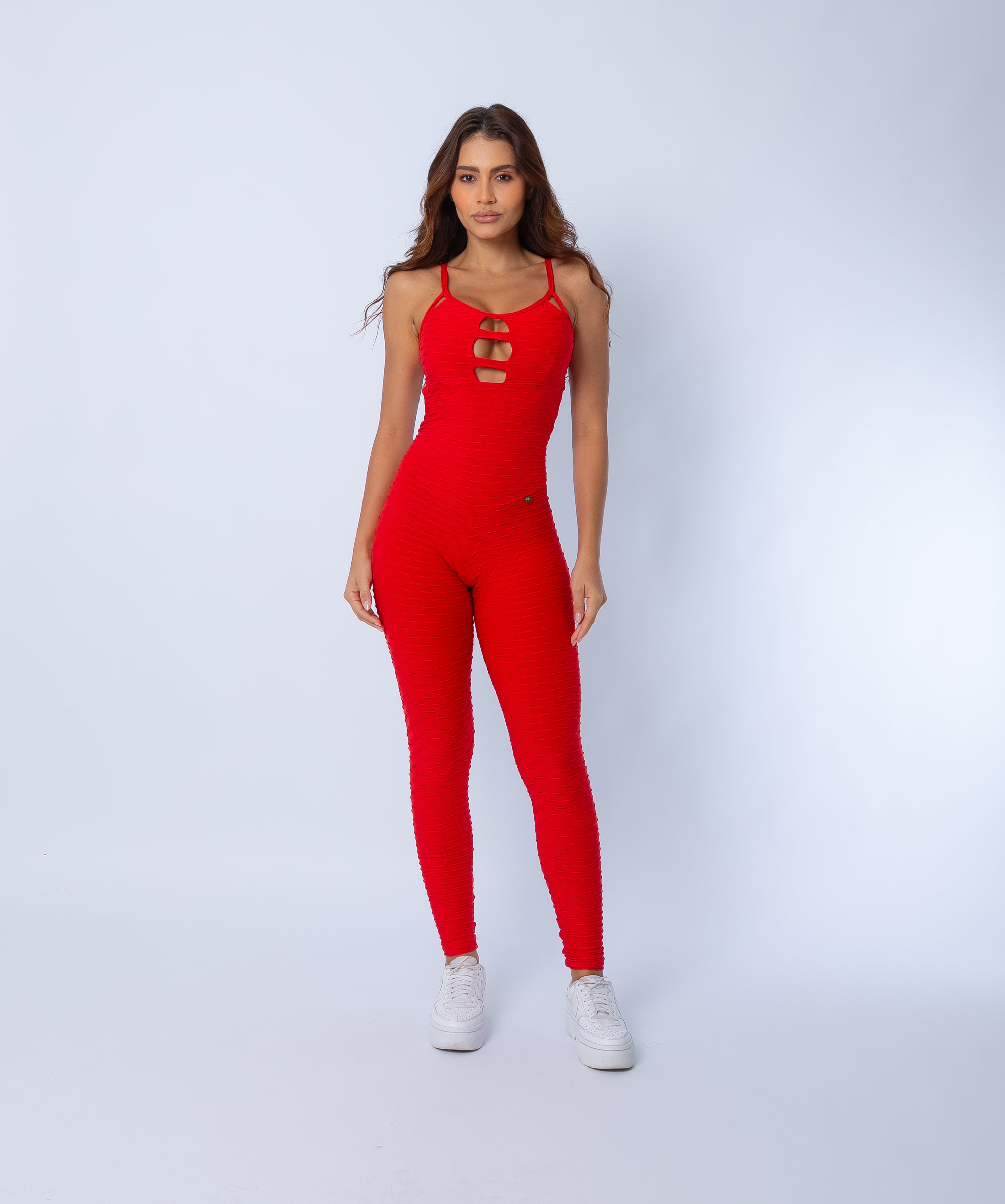 Fashion Brazil Amelia Red Jumpsuit, front view showing sculpting full-length fit, scrunch-back seam detail, and bold red Zero Flaws textured fabric.