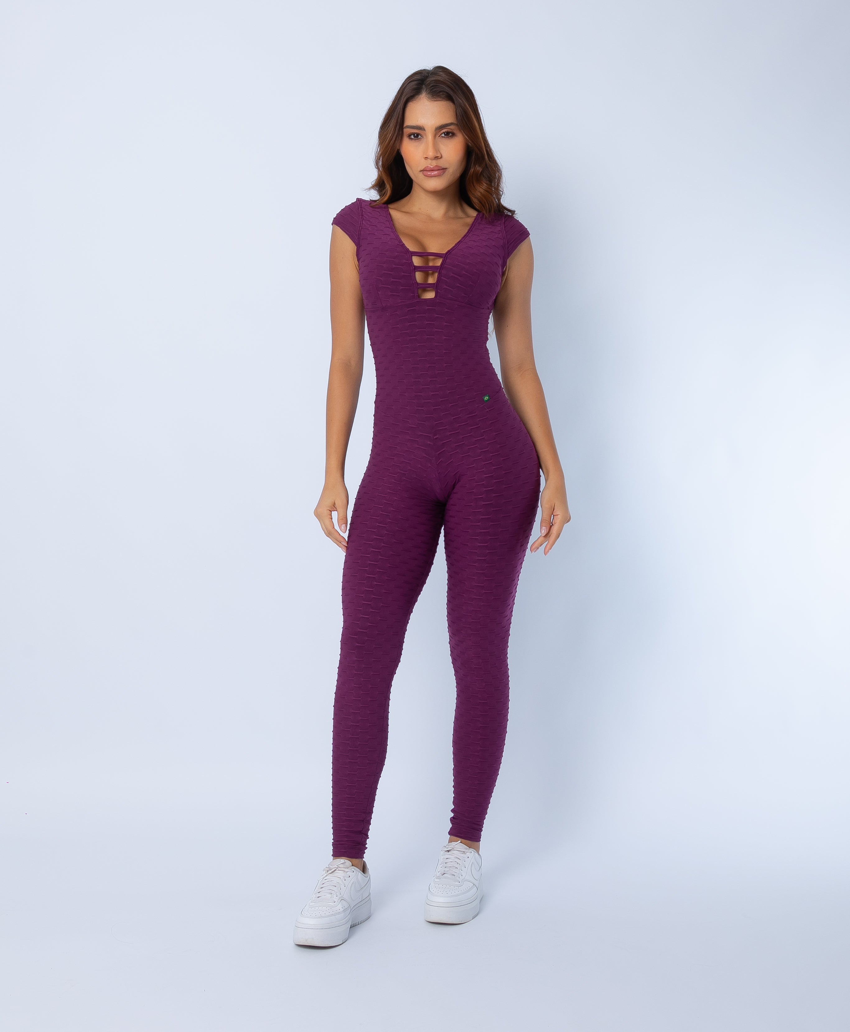 Fashion Brazil Selena Cap Sleeve Jumpsuit, front view with V-neckline and cut-out strap detail, sculpting one-piece fit in Zero Flaws textured fabric.