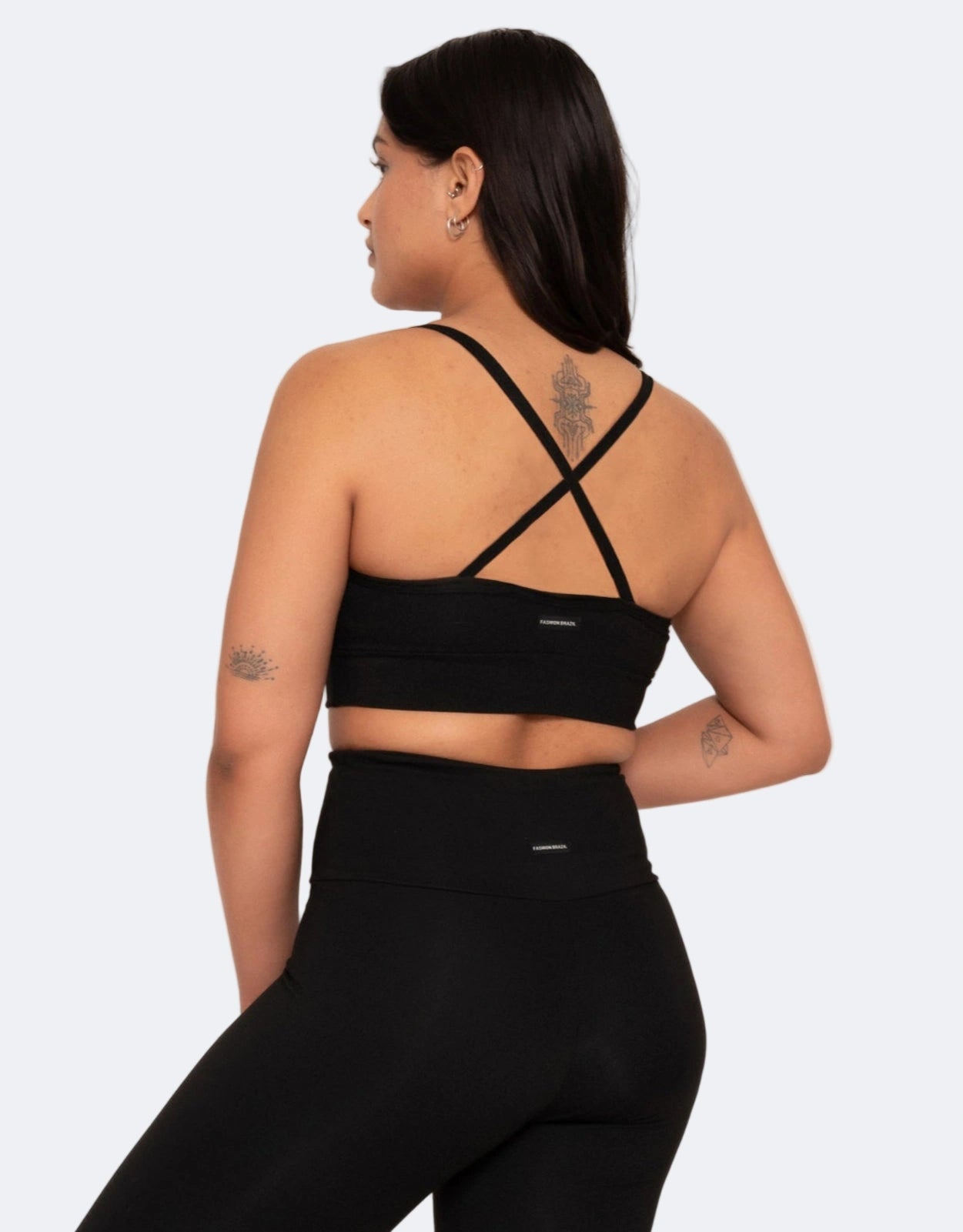 Black X back sports bra a white background