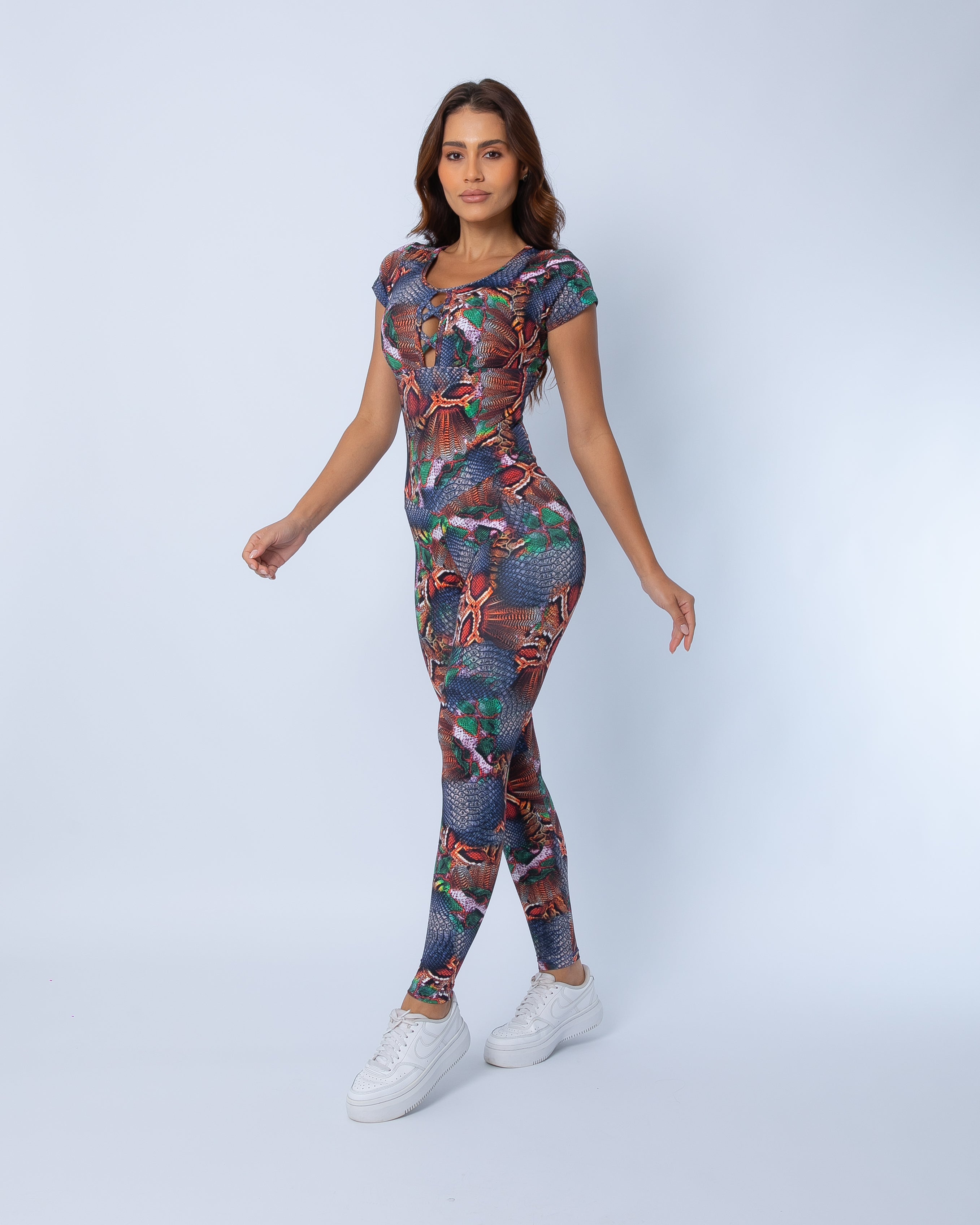 Fashion Brazil Copper Cobra Cap Sleeve jumpsuit front view, featuring lace-up neckline, cap sleeves, and copper, denim, and green snake-print pattern on a white background.